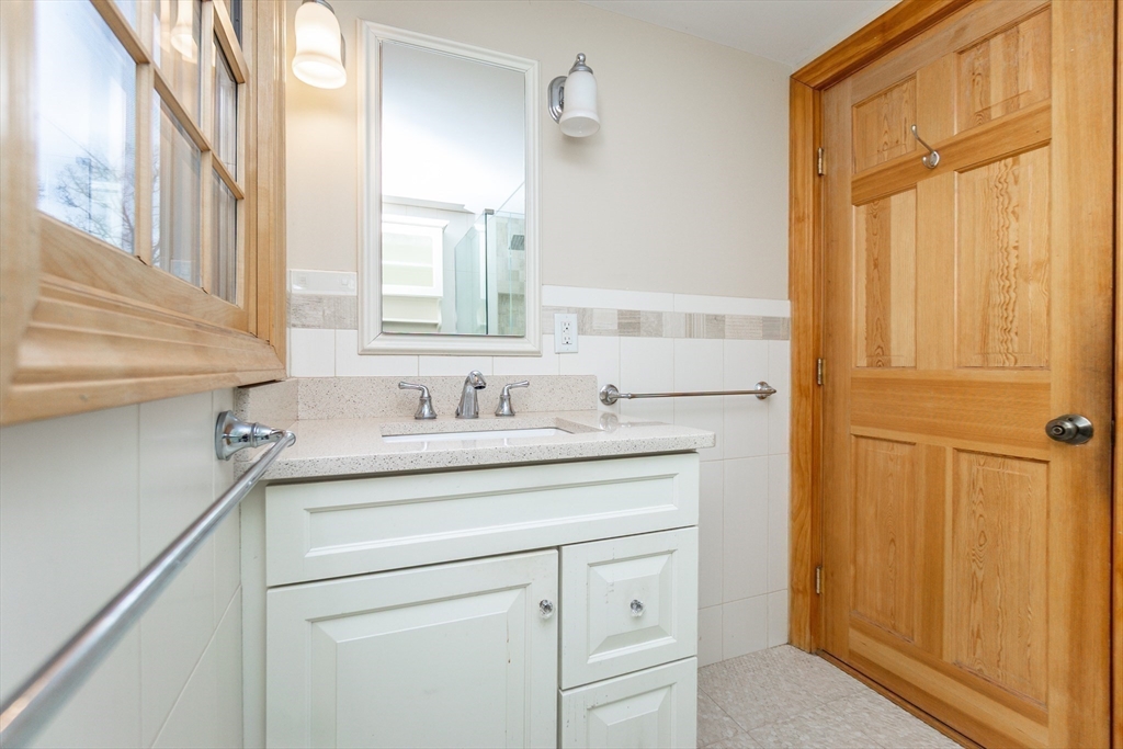19 Homestead Road Lynnfield, MA 01940 - Photo 22 of 34 a bathroom with a sink and a mirror