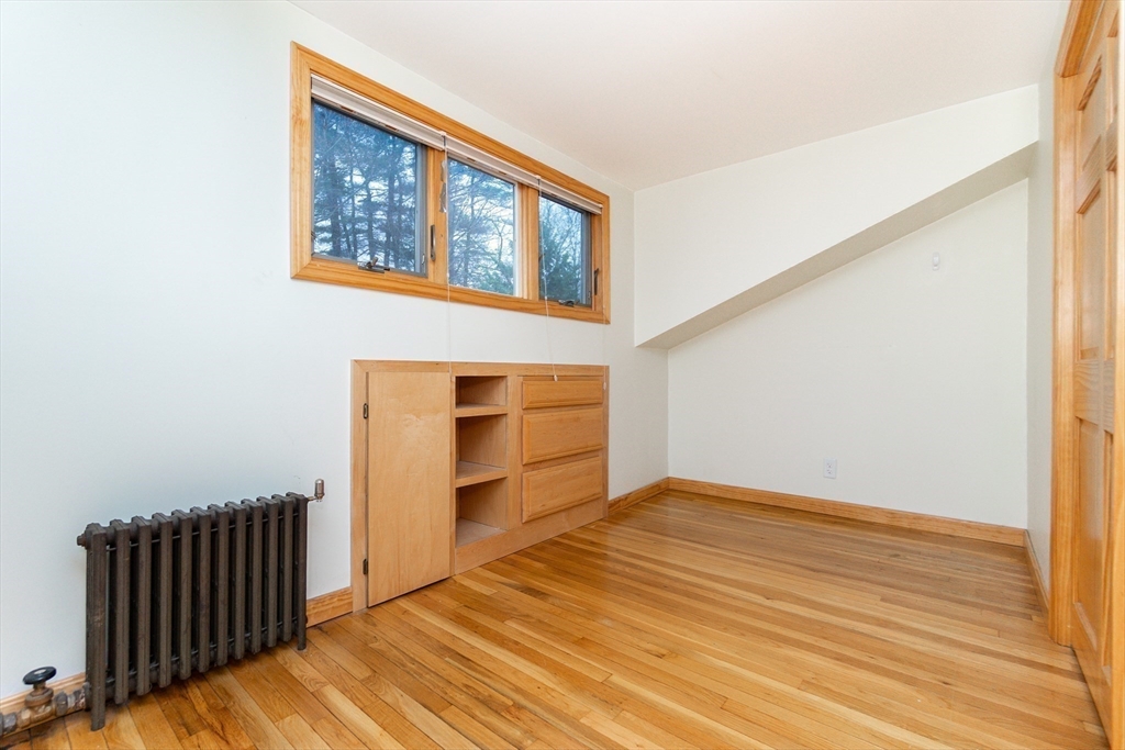 19 Homestead Road Lynnfield, MA 01940 - Photo 25 of 34 a view of an empty room with wooden floor and a window