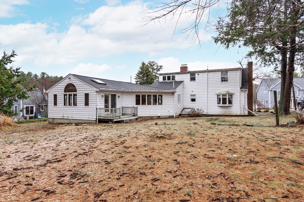 19 Homestead Road Lynnfield, MA 01940 - Photo 30 of 34 a house with trees in the background