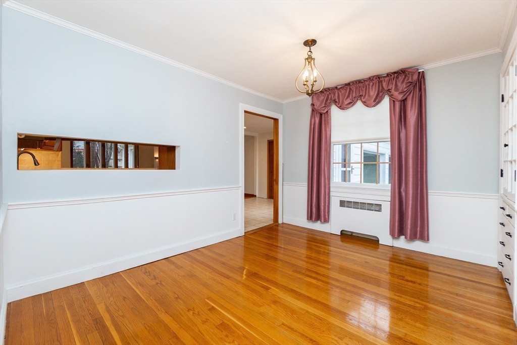 19 Homestead Road Lynnfield, MA 01940 - Photo 7 of 34 a view of an empty room with wooden floor and windows