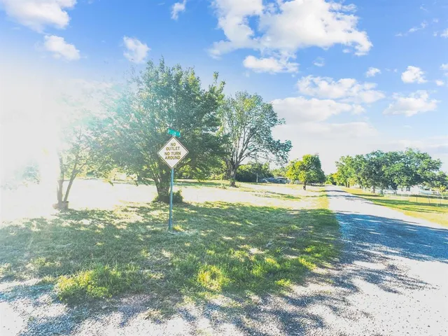 a view of yard with swimming pool and green space