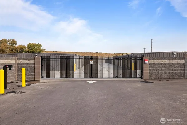 a view of outdoor space with wooden fence