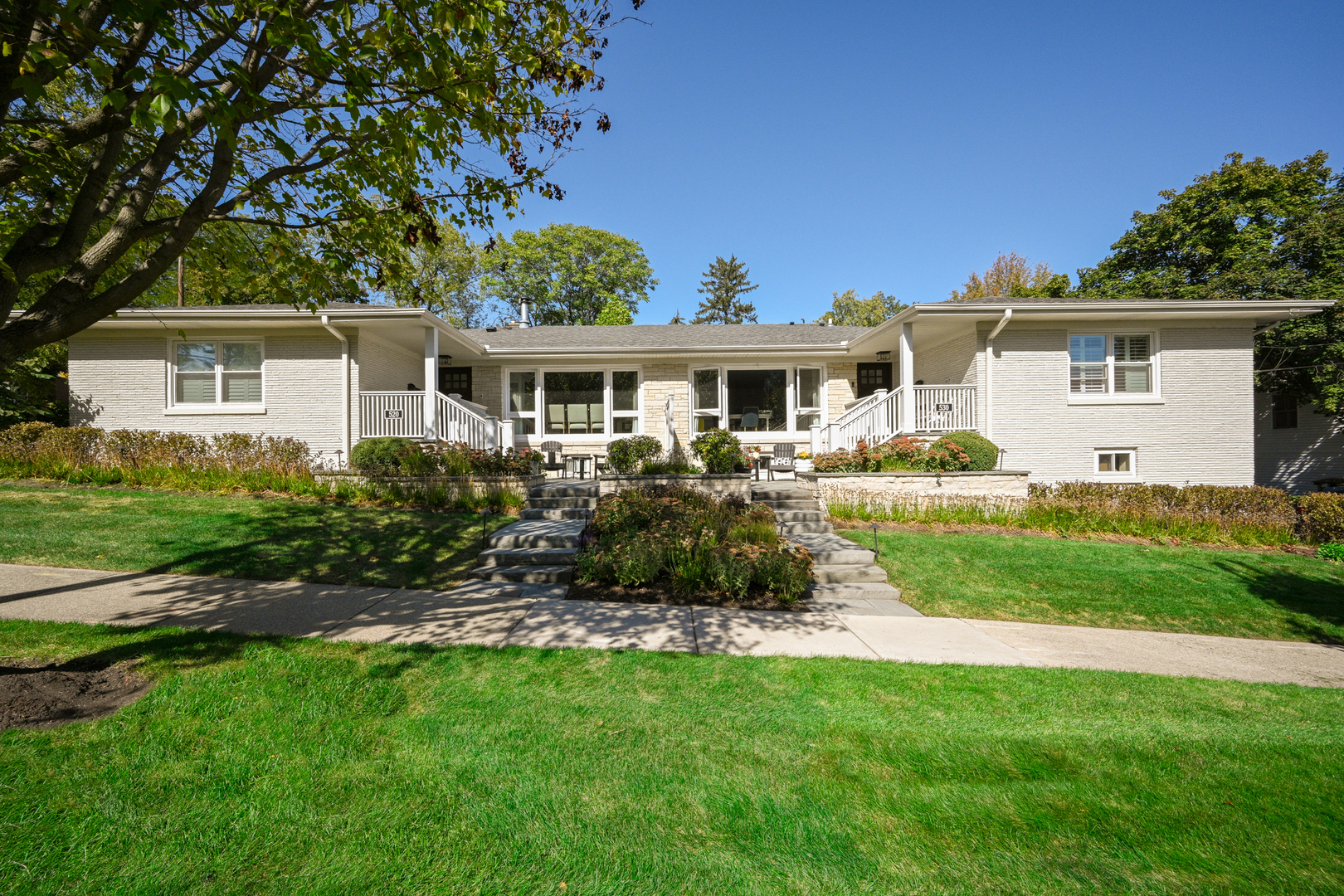 a front view of house with yard and green space