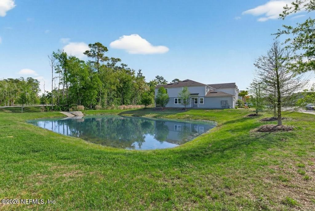45 Seaport Breeze Road St. Augustine, FL 32095 - Photo 8 of 88 a view of a lake with a house in the background