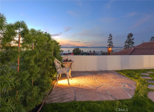 a view of a swimming pool with a yard