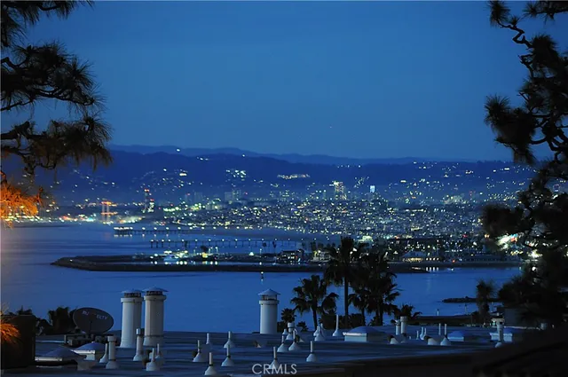 a kitchen with white cabinets and sink
