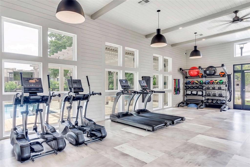 4020 McEwen Road, Unit 9123 Farmers Branch, TX 75244 - Photo 14 of 20 Workout area with beamed ceiling, a towering ceiling, french doors, wood walls, and ceiling fan