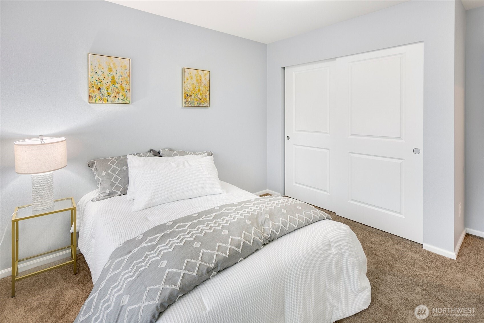 3931 177th Street Southeast Bothell, WA 98012 - Photo 25 of 39 a bedroom with a bed and painting on the wall