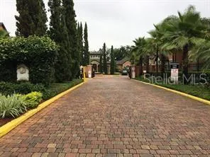 a pathway of a house with a yard