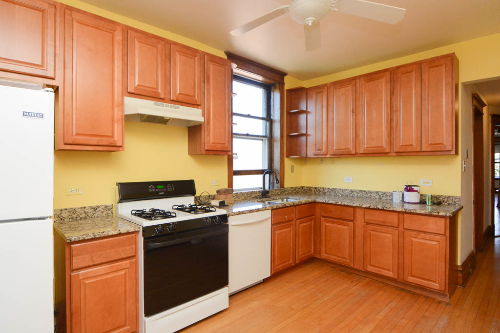 2225 West Walton Street, Unit 3 Chicago, IL 60622 - Photo 2 of 20 a kitchen with stainless steel appliances granite countertop a stove a sink dishwasher and a refrigerator