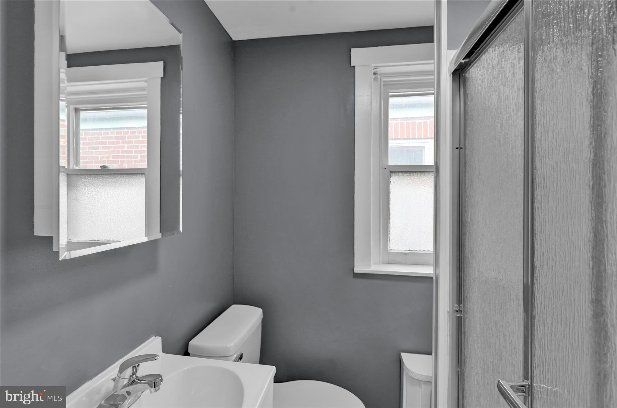 1409 Church Street Reading, PA 19601 - Photo 14 of 23 a bathroom with a toilet sink and mirror