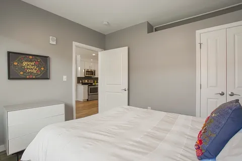 a bedroom with a bed and a cabinets