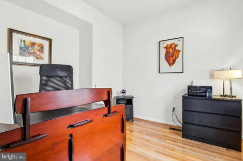 a room with furniture and wooden floor