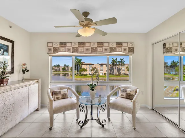 a dining room with furniture and chandelier