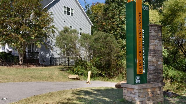 a view of a street with a tree