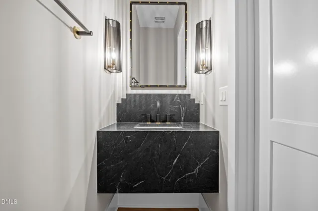 a white toilet sitting next to a window