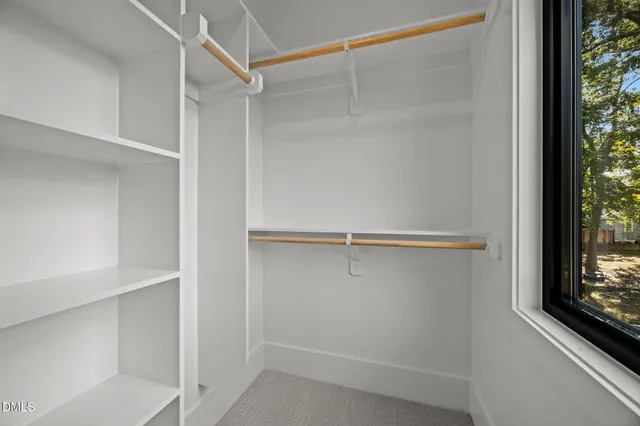 an empty room with windows and view