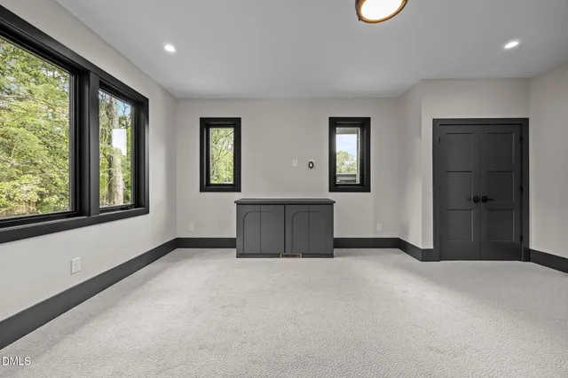 a view of living room filled with furniture and potted plant