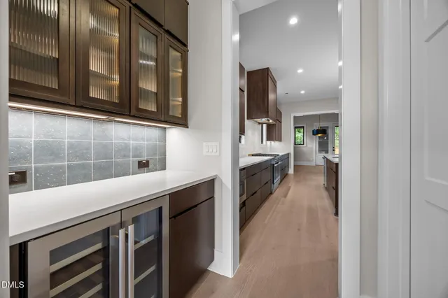a kitchen with stainless steel appliances a refrigerator and a sink