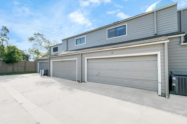 a view of backyard and garage