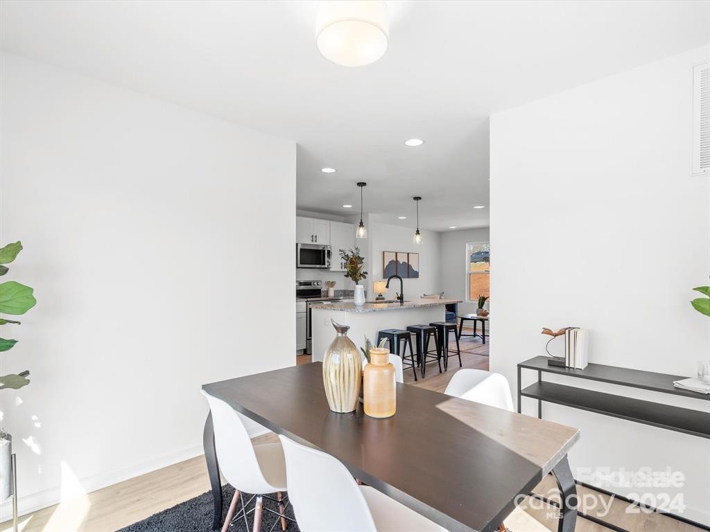 3799 Herman Sipe Road, Unit B Conover, NC 28613 - Photo 12 of 44 a view of a dining room with furniture