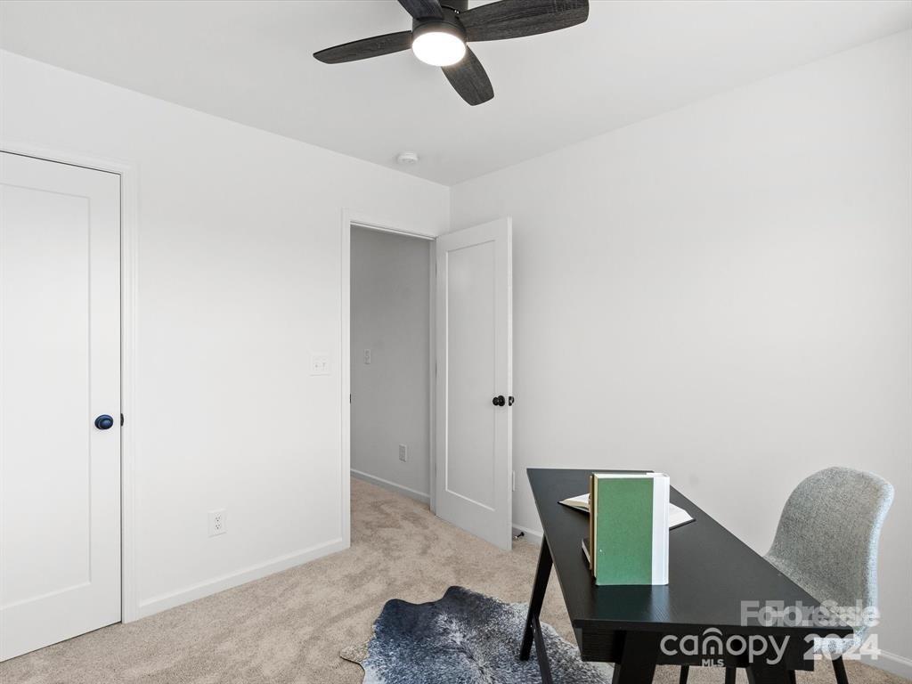 3799 Herman Sipe Road, Unit B Conover, NC 28613 - Photo 20 of 44 a workspace room with furniture and a ceiling fan