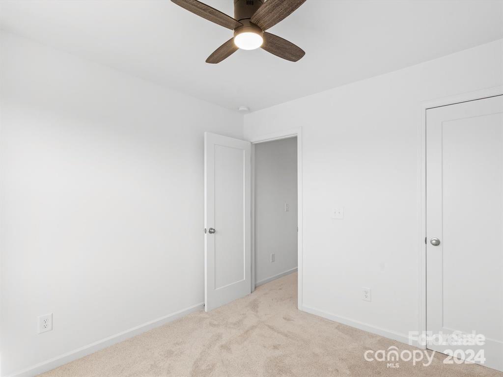 3799 Herman Sipe Road, Unit B Conover, NC 28613 - Photo 32 of 44 a view of a room with a ceiling fan and a window