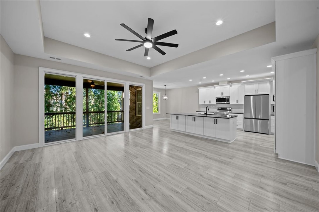 105 Bree Drive Anderson, SC 29621 - Photo 11 of 48 An open-concept living space with a contemporary kitchen flows seamlessly to a private deck.