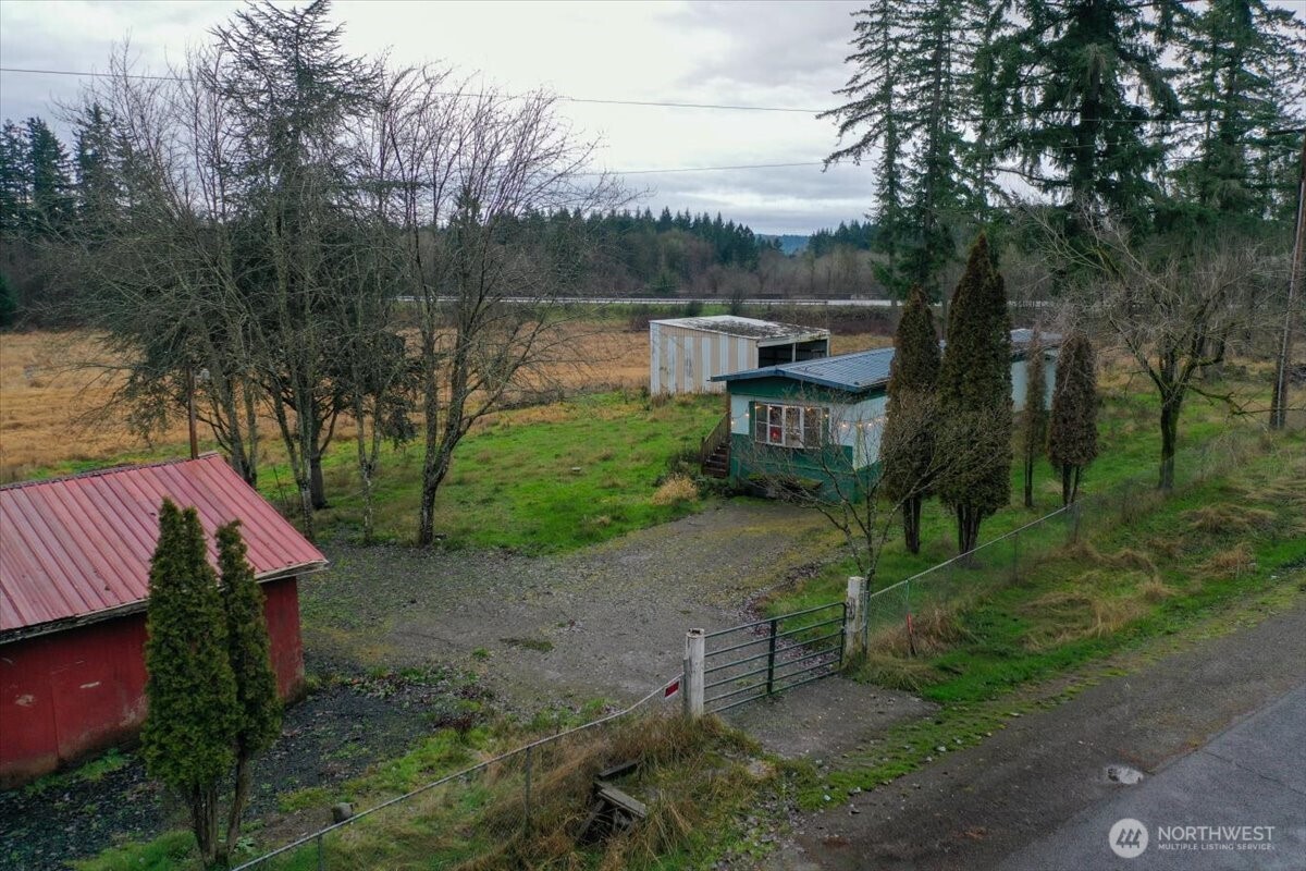 5347 216th Avenue Southwest Centralia, WA 98531 - Photo 2 of 15 a backyard of a house with table and chairs
