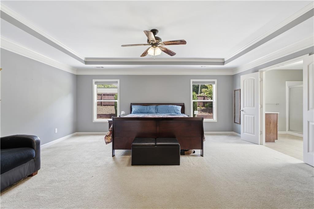 5825 Willow Oak Pass Cumming, GA 30040 - Photo 25 of 55 a living room with furniture a ceiling fan and a window