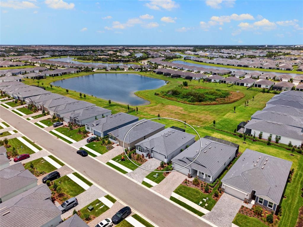 18237 Beach Ranch Terrace Bradenton, FL 34211 - Photo 10 of 72 an aerial view of residential houses with outdoor space