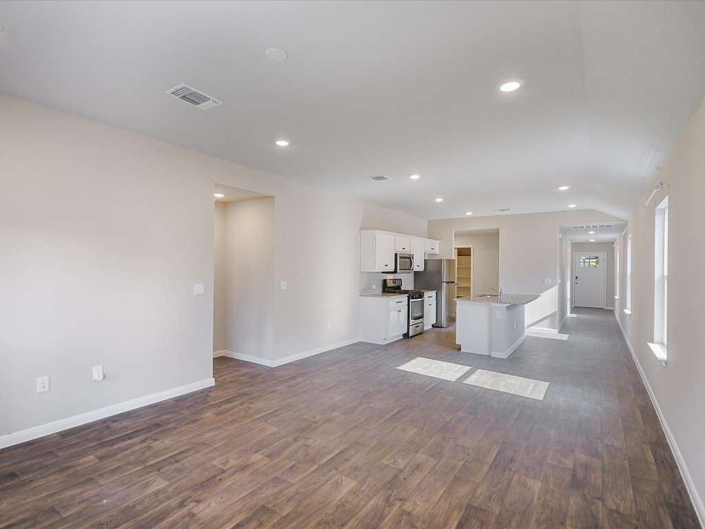 14408 Boquist Drive Pflugerville, TX 78660 - Photo 7 of 20 a view of a livingroom with wooden floor