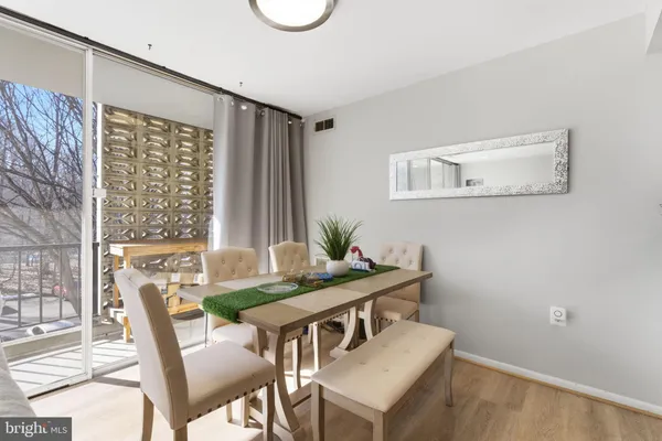 a kitchen with stainless steel appliances kitchen island granite countertop a sink a stove and cabinets