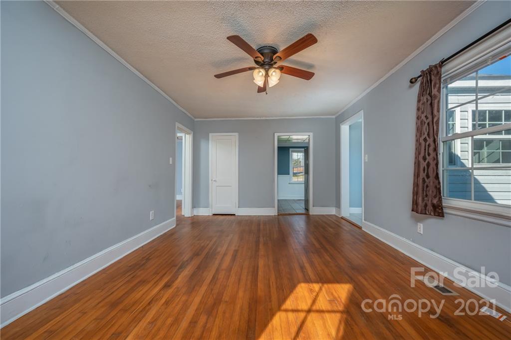 291 Cardinal Street Inman, SC 29349 - Photo 12 of 40 a view of an empty room with wooden floor and a window