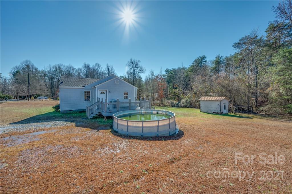291 Cardinal Street Inman, SC 29349 - Photo 3 of 40 a wooden house with a big yard and large trees