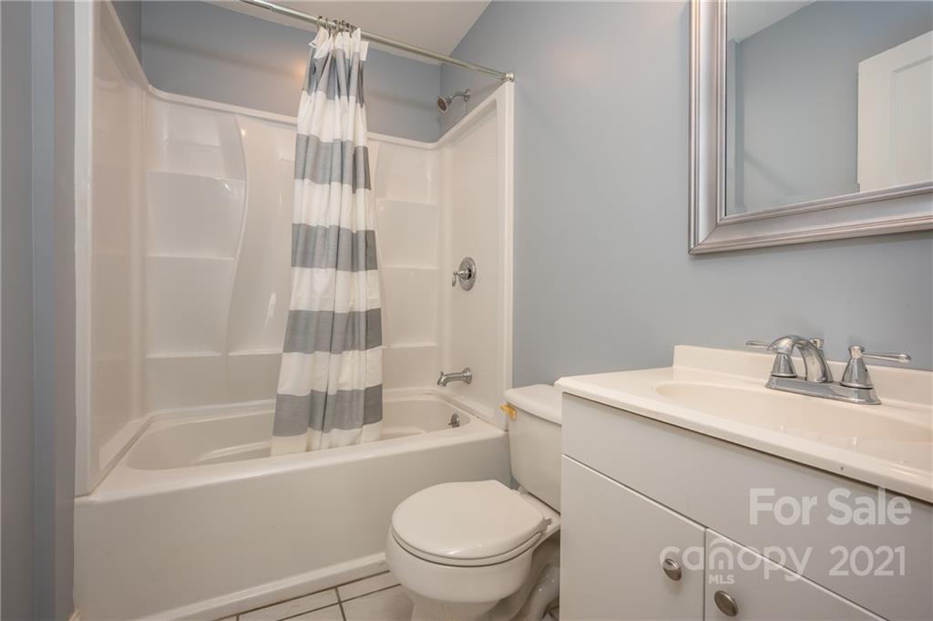 291 Cardinal Street Inman, SC 29349 - Photo 25 of 40 a bathroom with a sink toilet vanity and shower