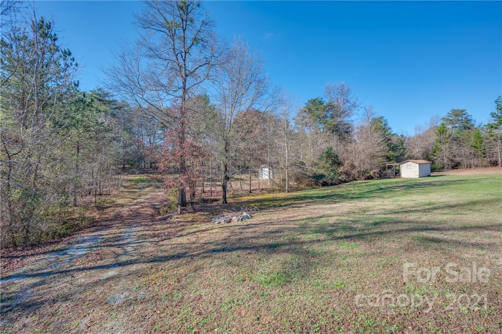291 Cardinal Street Inman, SC 29349 - Photo 26 of 40 a view of dirt yard with large trees