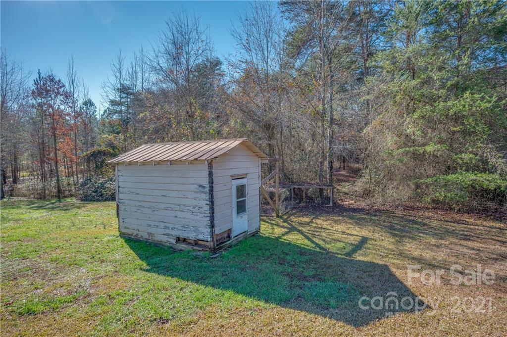 291 Cardinal Street Inman, SC 29349 - Photo 39 of 40 a view of a backyard with barn and large trees