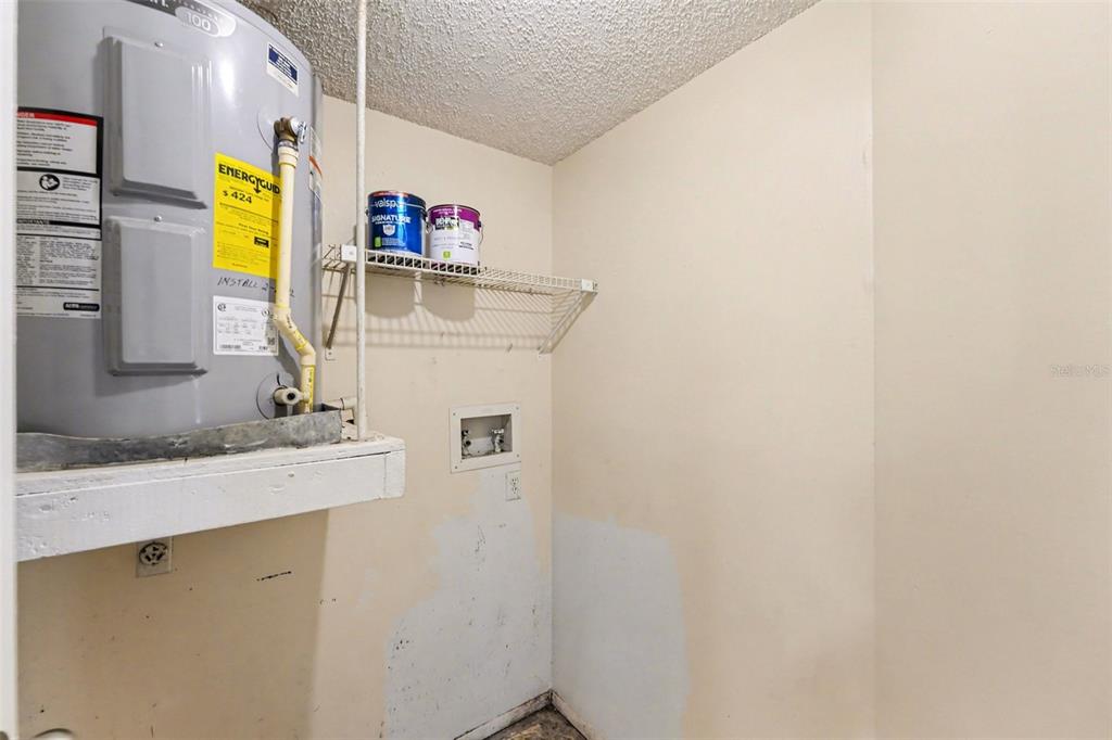 129 Camphor Circle, Unit F Oldsmar, FL 34677 - Photo 12 of 38 a utility room with dryer and washer