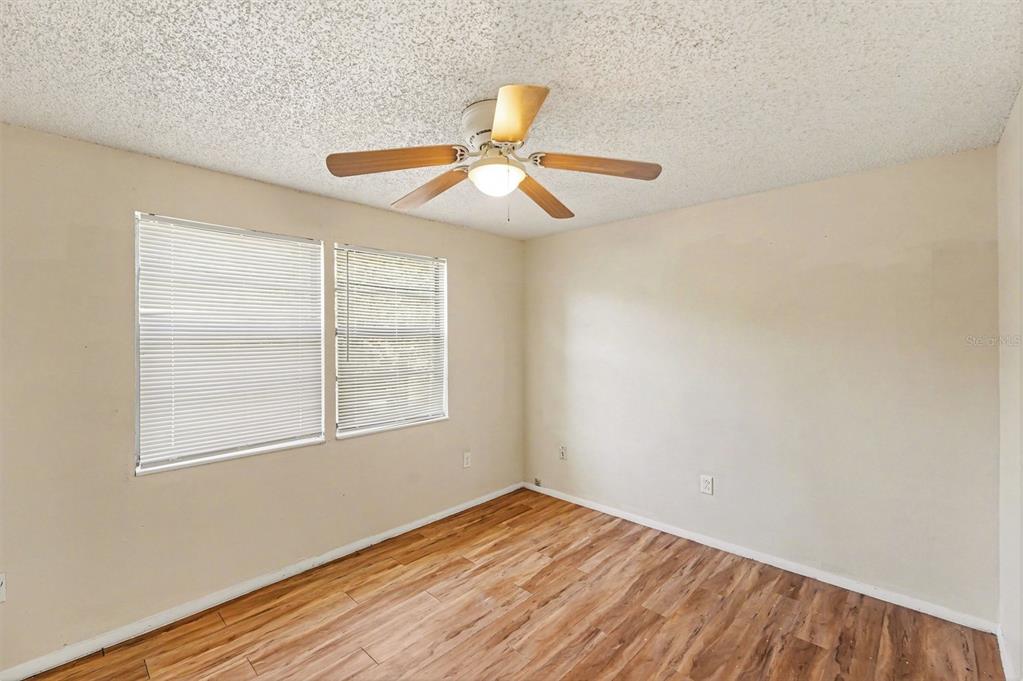 129 Camphor Circle, Unit F Oldsmar, FL 34677 - Photo 14 of 38 wooden floor in an empty room with a window