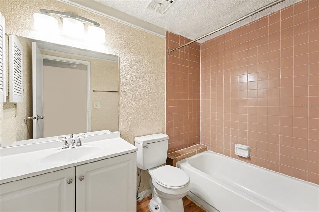 129 Camphor Circle, Unit F Oldsmar, FL 34677 - Photo 17 of 38 a bathroom with a sink toilet and shower