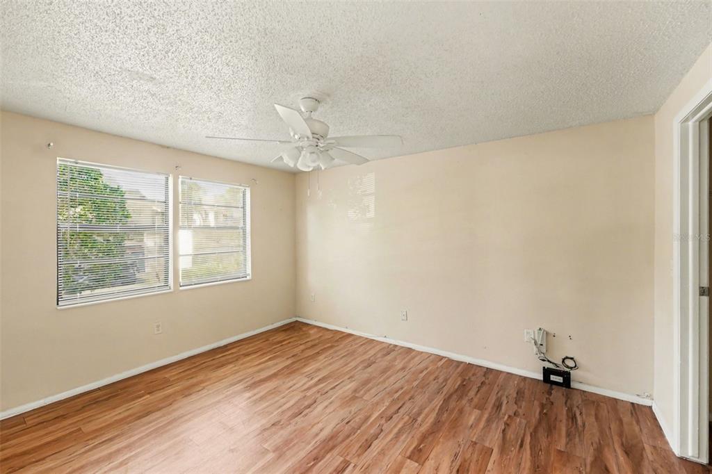 129 Camphor Circle, Unit F Oldsmar, FL 34677 - Photo 19 of 38 wooden floor in an empty room with a window