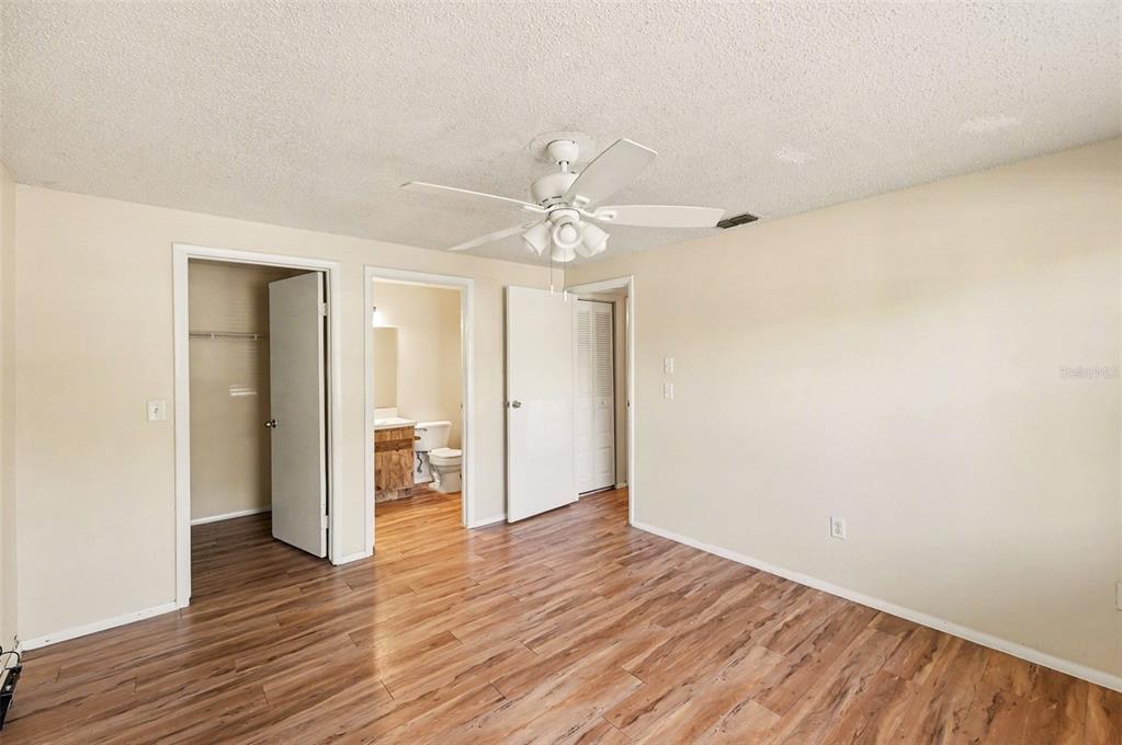 129 Camphor Circle, Unit F Oldsmar, FL 34677 - Photo 20 of 38 a view of an empty room with wooden floor