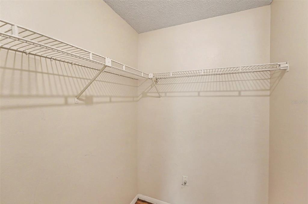 129 Camphor Circle, Unit F Oldsmar, FL 34677 - Photo 22 of 38 a view of a room with racks on the wall