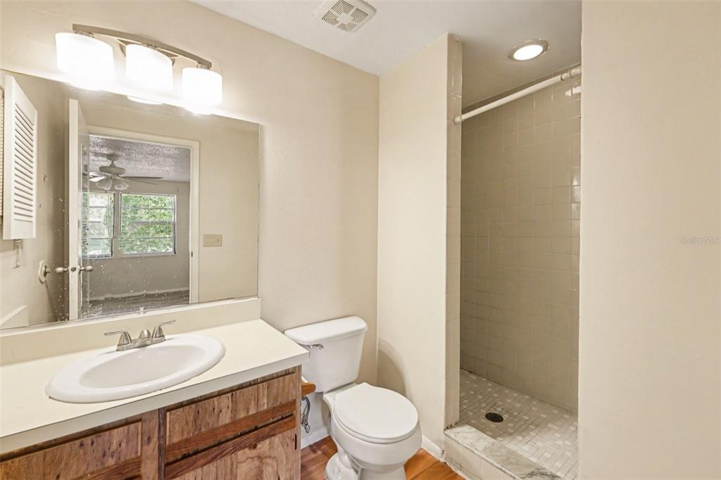 129 Camphor Circle, Unit F Oldsmar, FL 34677 - Photo 23 of 38 a bathroom with a sink a toilet and shower