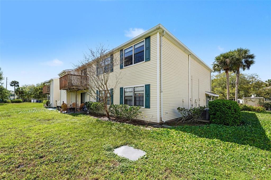 129 Camphor Circle, Unit F Oldsmar, FL 34677 - Photo 30 of 38 a front view of house with yard and green space