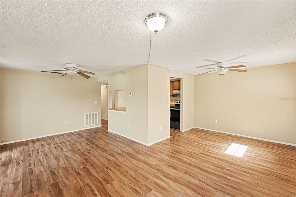 129 Camphor Circle, Unit F Oldsmar, FL 34677 - Photo 6 of 38 wooden floor in an empty room with a window