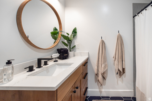 1276 West Fallow Way, Unit 76 Ogden, UT 84414 - Photo 7 of 22 Full bathroom with vanity, a shower with curtain, and tile patterned floors