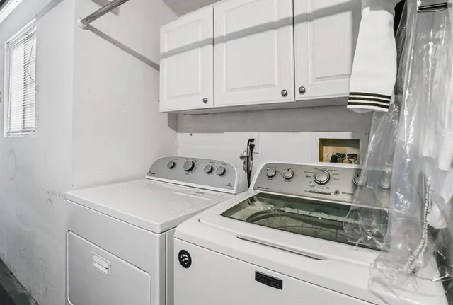 a view of washer and dryer with kitchen appliances