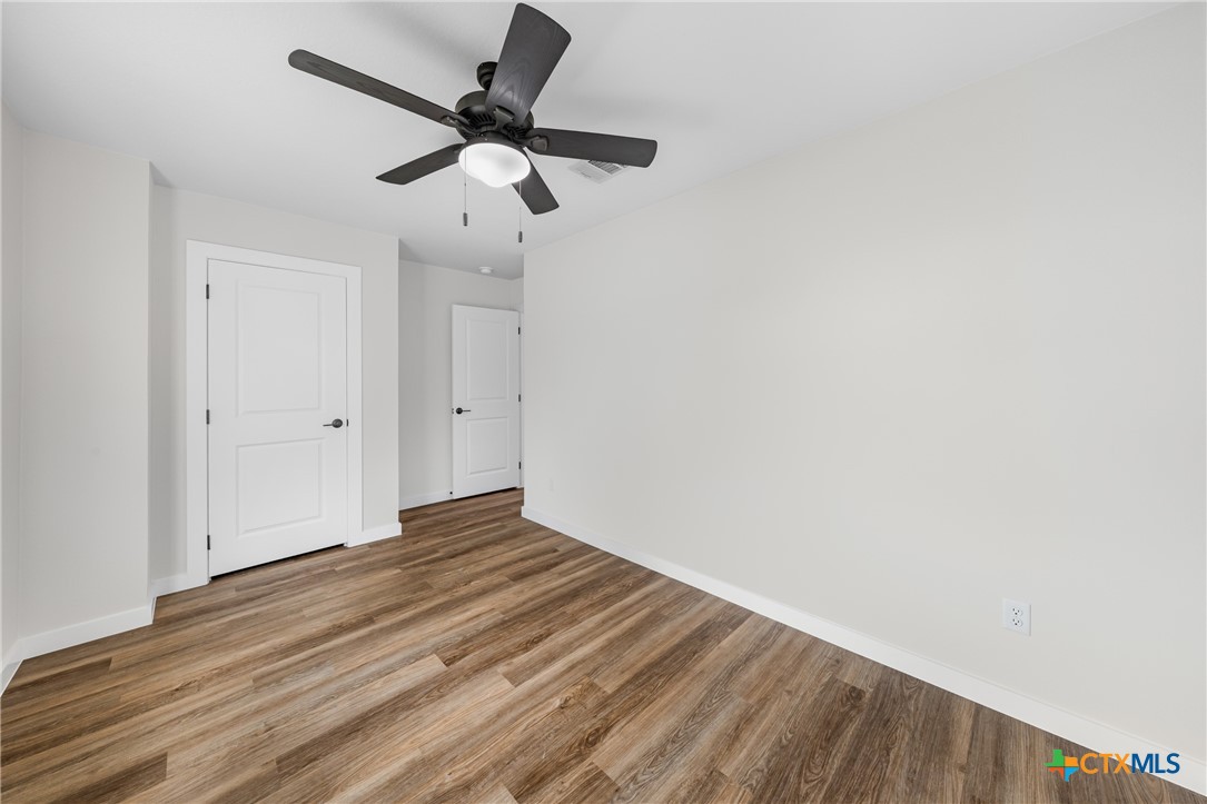 905 Martin Luther King Jr Lane, Unit B Temple, TX 76504 - Photo 23 of 24 a view of empty room with wooden floor